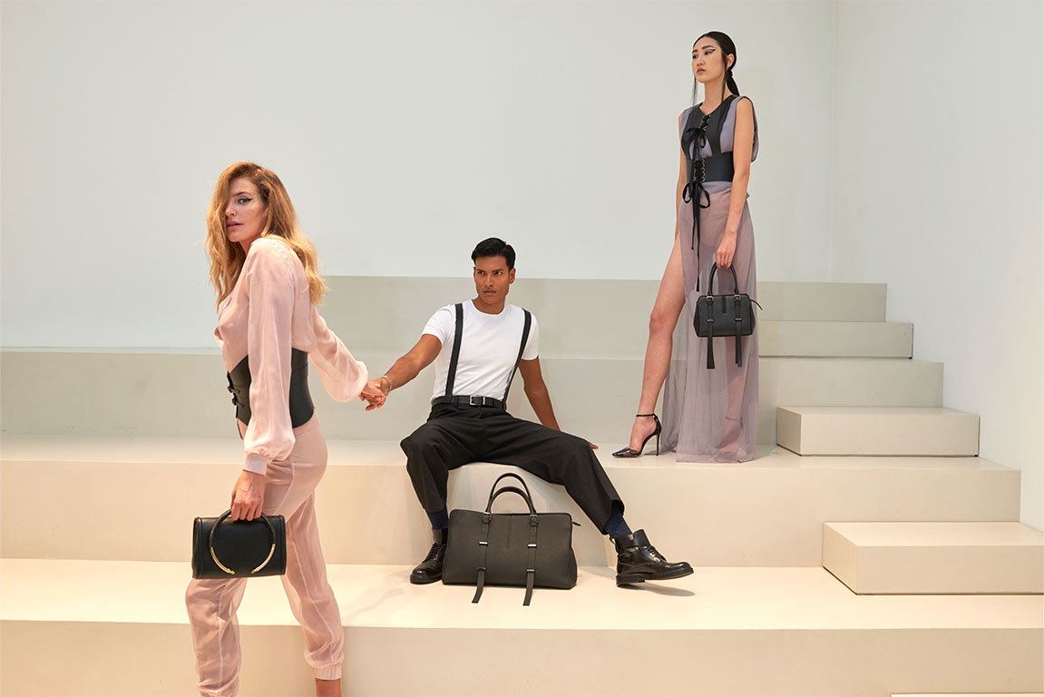 Chic woman featuring a PK1 Milano leather clutch