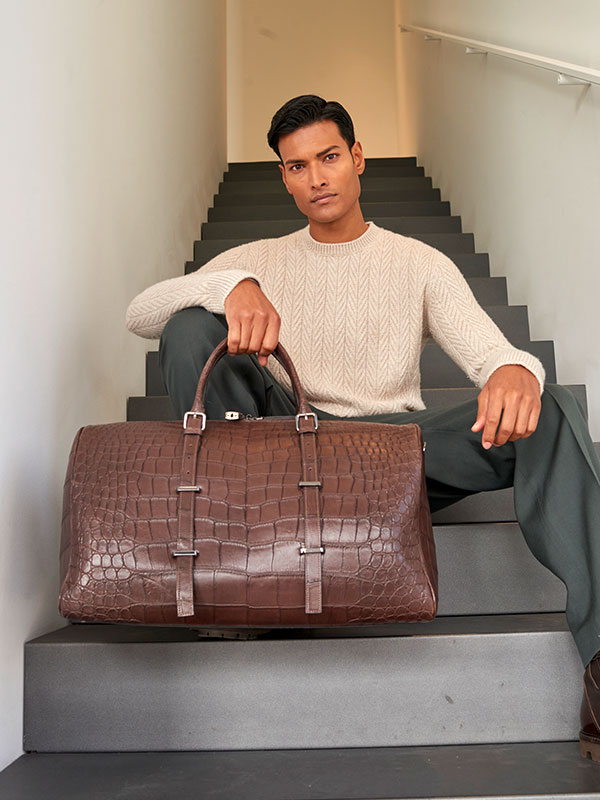 Eleonora and Filippo, founders of PK1 Milano, showcasing handcrafted luxury leather goods made by Italian artisans