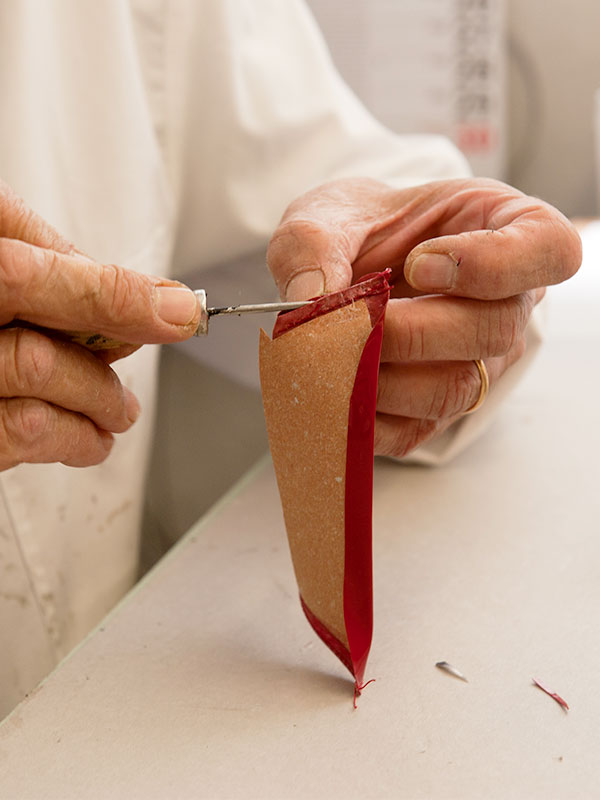 Artisan customizing a luxury leather bag at PK1 Milano, turning customer dreams into meticulously crafted products