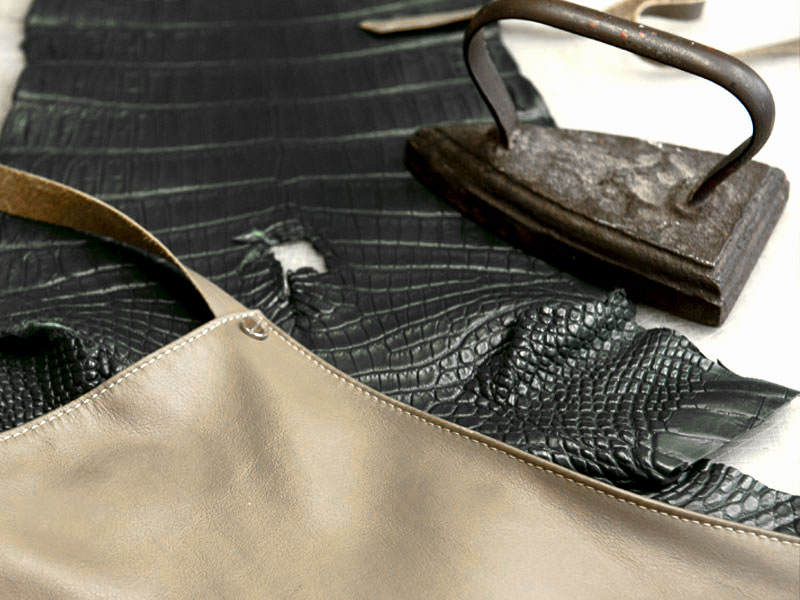 Designers collaborating on leather bag sketches at PK1 Milano consulting studio